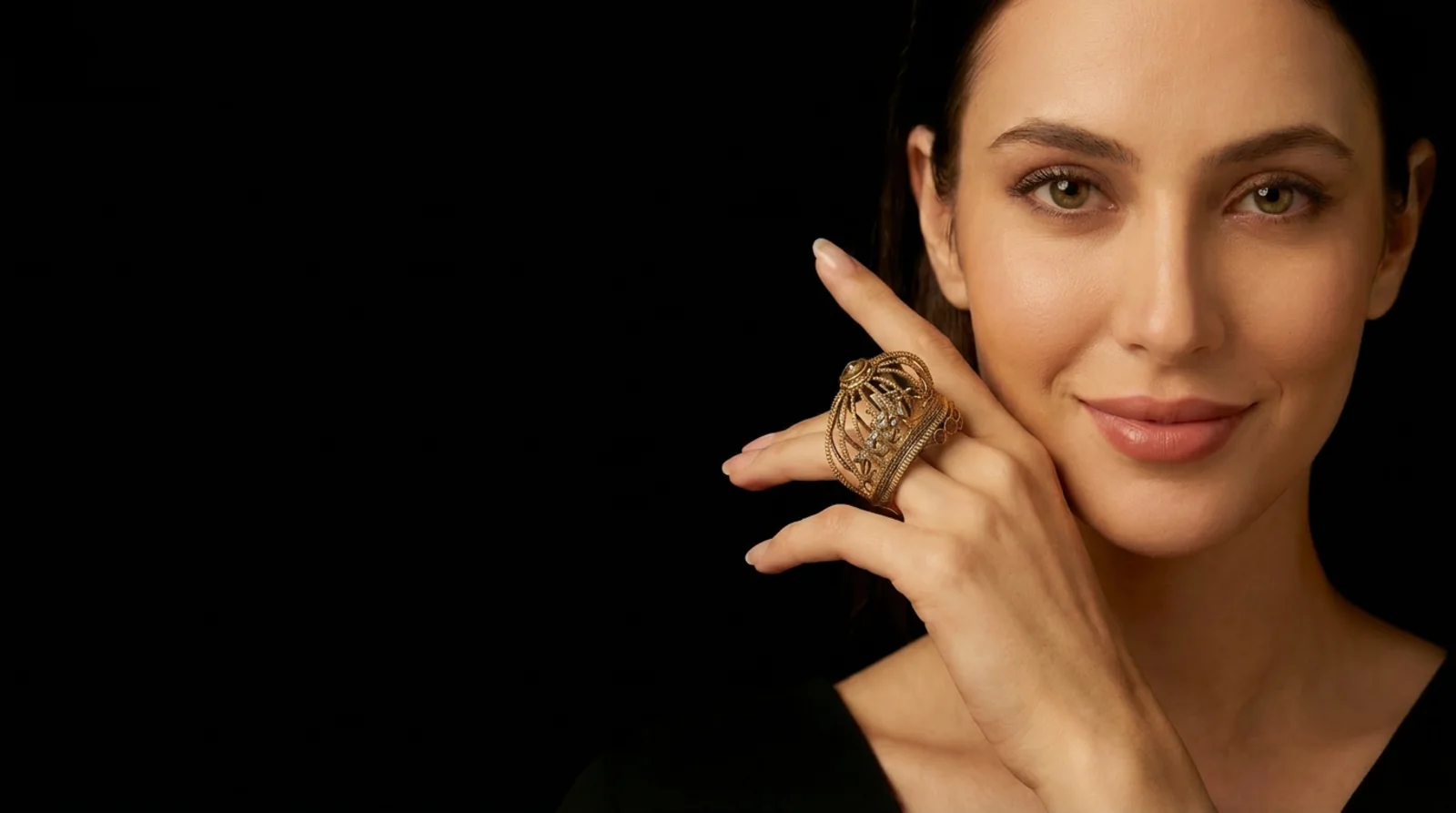 Maison Astral gold cage ring worn by a model
